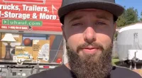 TikTok user @Billcoproductions stands near a Uhaul truck but he's not moving