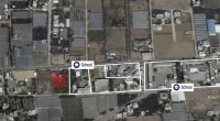 The image appears to reveal site of a rocket launcher next to two Gazan schools