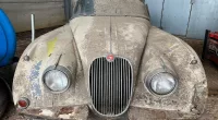 Rust bucket 1958 Jaguar car once used as chicken coop is discovered