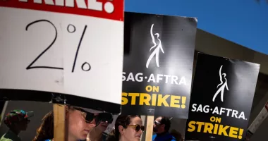 Los Angeles, CA - July 26: Members of the Writers Guild of America (WGA), joined by members of the Screen Actors Guild (SAG) and American Federation of Television and Radio Artists (AFTRA), come together to picket in front of Paramount Studios, in Los Angeles, CA, Wednesday, July 26, 2023. Entertainment's largest guilds have come together, during disputed contract negotiations with the Alliance of Motion Picture and Television Producers (AMPTP).(Jay L. Clendenin / Los Angeles Times via Getty Images)