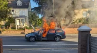 A car caught fire with a young family inside and was engulfed by flames in seconds