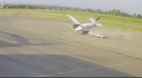 CCTV footage caught the moment a plane clipped its wing on the runway and was sent skidding towards a building where it crashed and burned