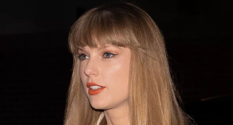 Taylor Swift looks chic in a peacoat for dinner with the Haim sisters