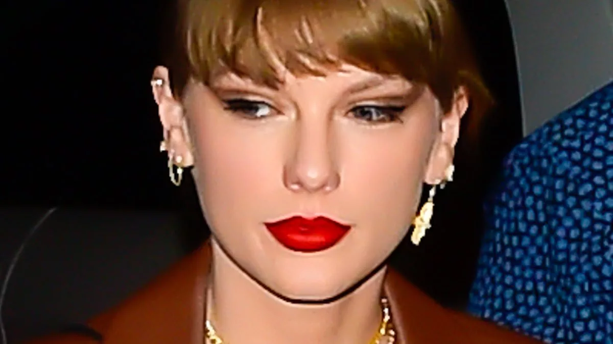 Taylor Swift oozes NYC chic in busty blouse and high-cut skirt