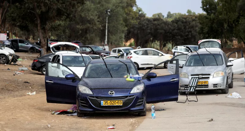 Abandoned cars and scattered belongings litter the road  after the deadly terror attack on Israel