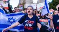 Tisch family members project faces of Israeli hostages on NYU building