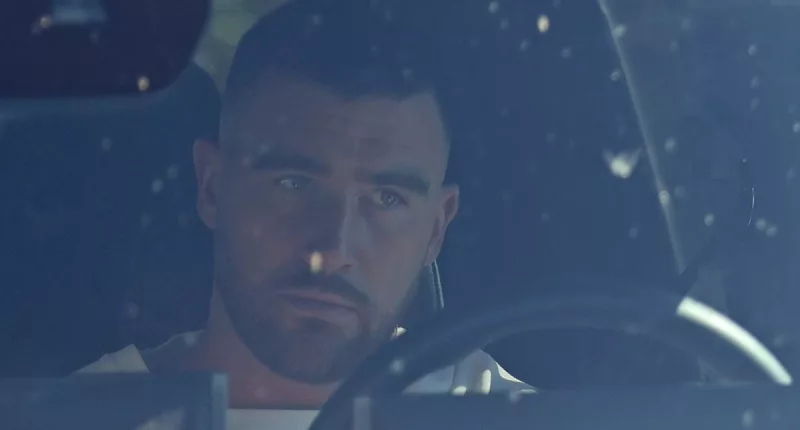 Travis Kelce collects an order at Firehouse Subs without Taylor Swift