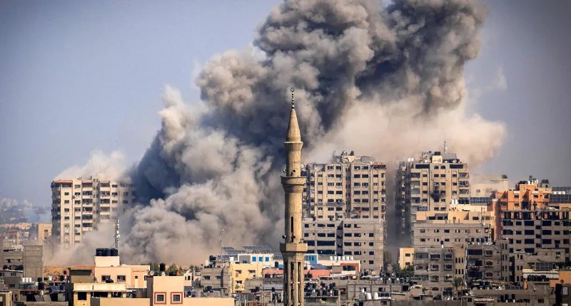 Smoke plumes billow into the sky during Israeli airstrikes in Gaza City