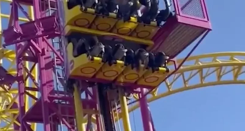 Rollercoaster riders were trapped dangling in the air for over half an hour