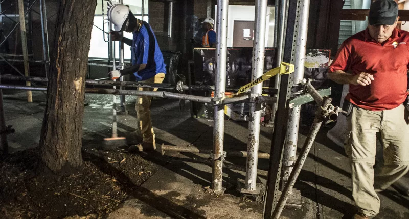 Workmen clearing the explosion site of the Chelsea, New York City bombing on September 18, 2016