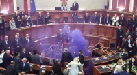Albanian opposition lawmakers throw firecrackers, disrupt Parliament in protest of socialist governance