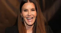 Janice Dickinson smiling with her mouth open