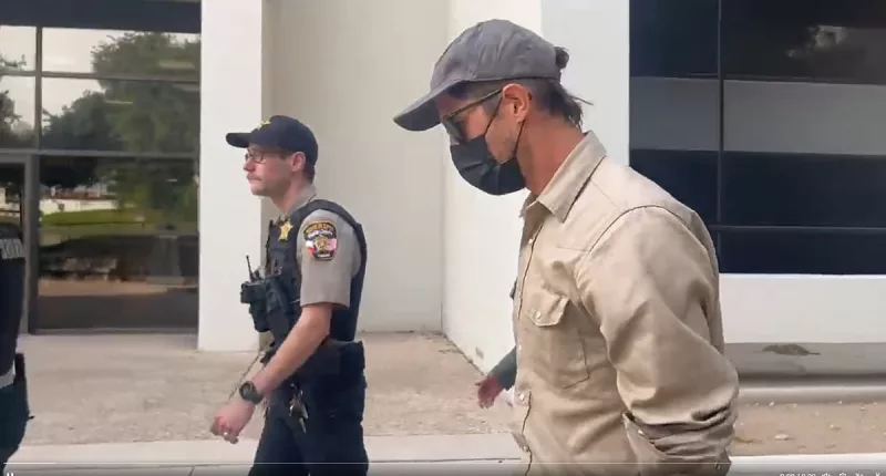 Boyfriend of 'killer' yoga teacher STAMPS on cameraman's foot