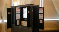 FILE - New state-issued voting machines used for the Georgia primary election on June 9, 2020, are seen at Park Tavern in Atlanta. U.S. District Judge Amy Totenberg issued a 135-page ruling late Friday, Nov. 10, 2023 in a long-running lawsuit filed by activists who want the state to ditch its electronic voting machines in favor of hand-marked paper ballots.(AP Photo/Brynn Anderson, File)