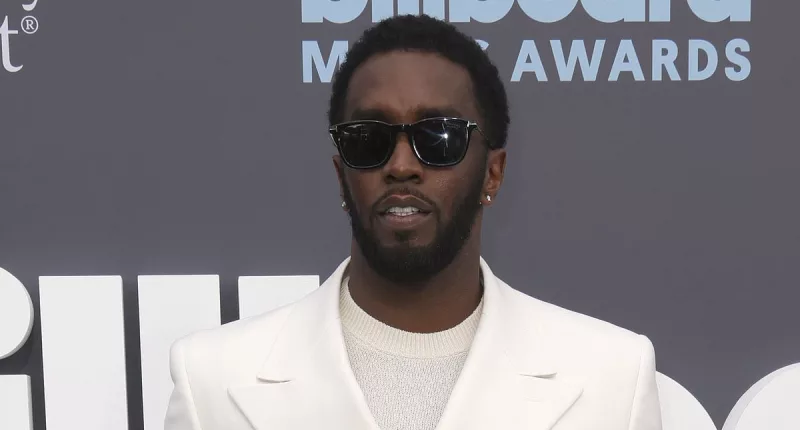 Diddy is sued for rape by a THIRD woman who claims he also choked her