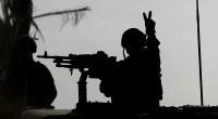 An Israeli soldier flashes a V for Victory sign as their tanks rolled into Gaza City to wipe out Hamas
