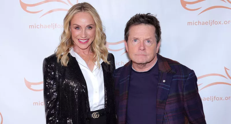 Michael J. Fox supported by wife Tracy and kids at Parkinson's gala
