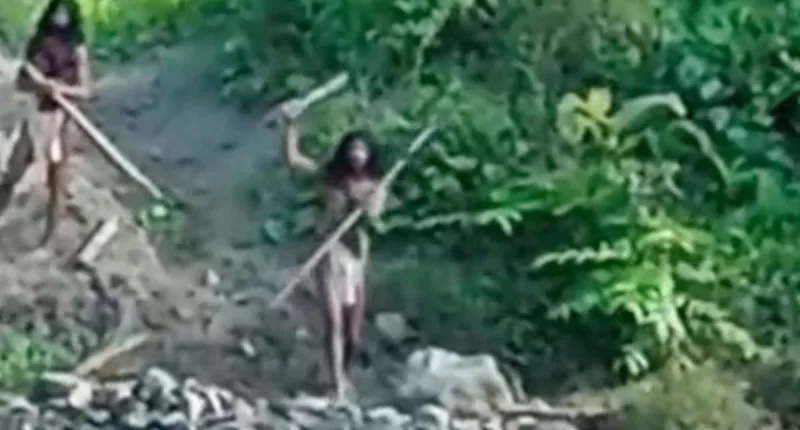 Moment indigenous tribe threatens workers on territory in Indonesia