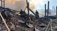 In this photo provided by the Ukrainian Emergency Service, emergency services personnel work to extinguish a fire following a Russian attack in Kryvyi Rih, Ukraine, Friday, Sept. 8, 2023. (Ukrainian Emergency Service via AP)