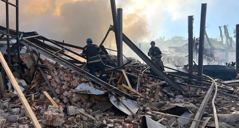In this photo provided by the Ukrainian Emergency Service, emergency services personnel work to extinguish a fire following a Russian attack in Kryvyi Rih, Ukraine, Friday, Sept. 8, 2023. (Ukrainian Emergency Service via AP)