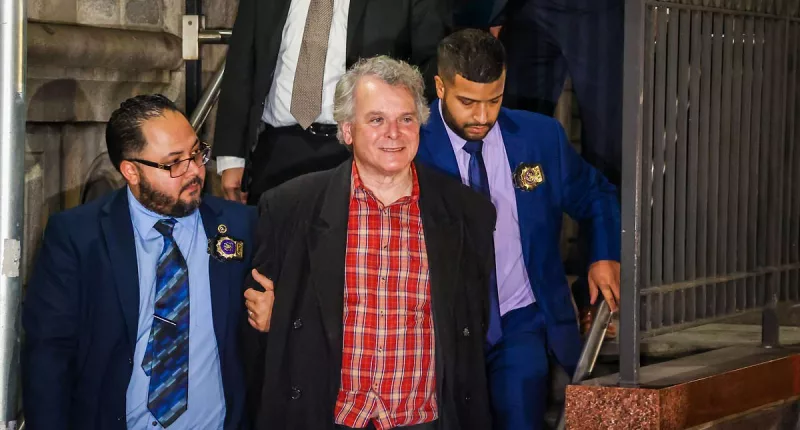 Obama's ex-National Security Council advisor SMILES during perp walk