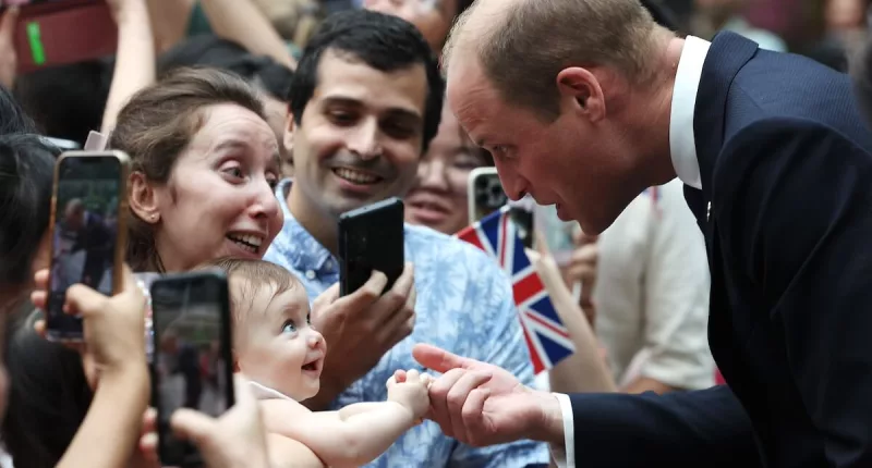 Prince William with a baby in Singapore in 2023