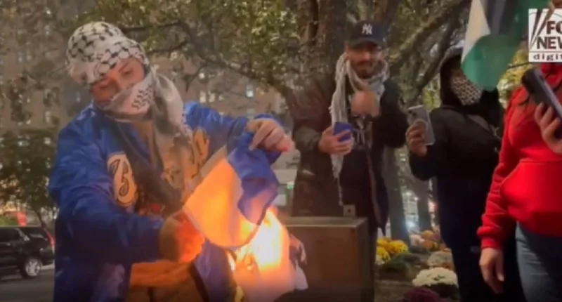 Pro-Palestinian demonstrator sets Israeli flag on fire in NYC protest, stomps on it