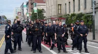 Protestors clash with riot police in SF to 'shut down' APEC summit