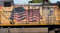 FILE - An American flag is emblazoned on this Union Pacific Railroad locomotive sitting in the Jackson, Miss., terminal rail yard, Wednesday, April 20, 2022. Union Pacific reports earnings on Thursday, Oct. 19, 2023. (AP Photo/Rogelio V. Solis, File)