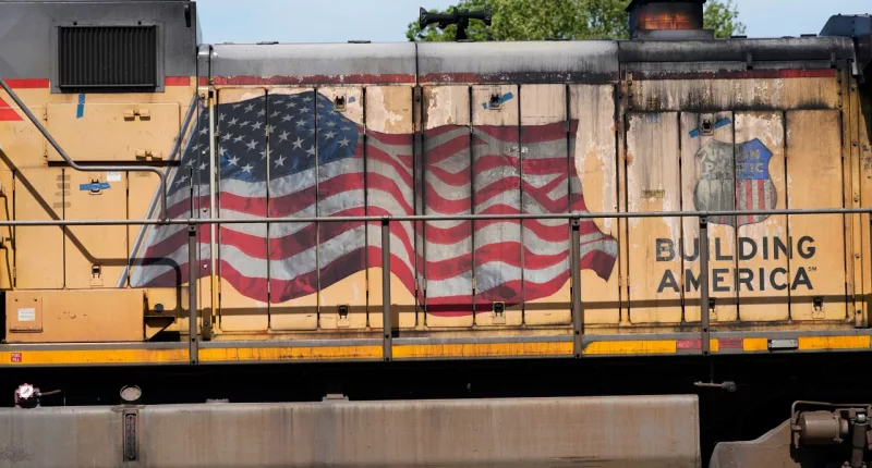 FILE - An American flag is emblazoned on this Union Pacific Railroad locomotive sitting in the Jackson, Miss., terminal rail yard, Wednesday, April 20, 2022. Union Pacific reports earnings on Thursday, Oct. 19, 2023. (AP Photo/Rogelio V. Solis, File)