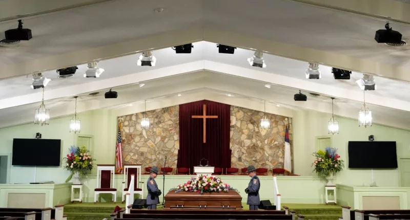 An honor guard from the Georgia State Patrol stand at the casket before the funeral service for former first lady Rosalynn Carter at Maranatha Baptist Church, Wednesday, Nov. 29, 2023, in Plains, Ga. The former first lady died on Nov. 19. She was 96. (AP Photo/Alex Brandon, Pool)