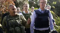 Lord Cameron, pictured with Eli Cohen, visits Kibbutz Be'eri where Hamas terrorists massacred Israeli civilians