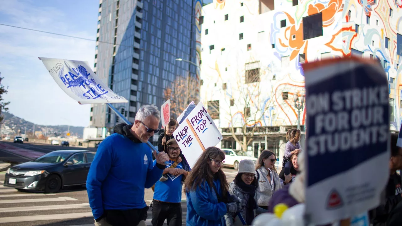 Striking Portland teachers temporarily block downtown bridge