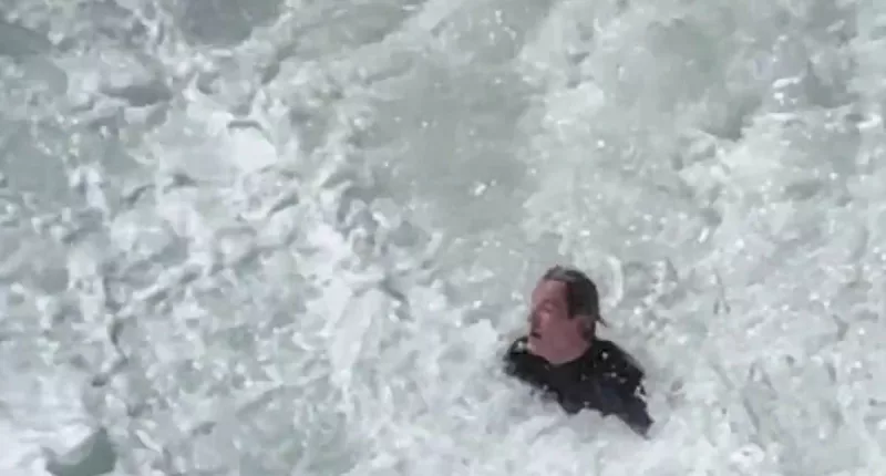 Surfer pounded by huge waves before Bondi Rescue guard helps him