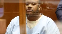 Suspect charged with killing man appears handcuffed in court