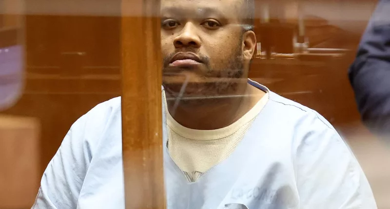 Suspect charged with killing man appears handcuffed in court