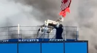 Terrifying moment worker trapped at the top of burning tower