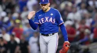 Texas Rangers starting pitcher Nathan Eovaldi reacts against the Texas Rangers during the fourth inning in Game 5 of the baseball World Series Wednesday, Nov. 1, 2023, in Phoenix. (AP Photo/Godofredo A. Vásquez)