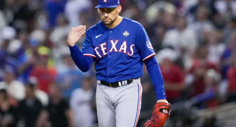 Texas Rangers starting pitcher Nathan Eovaldi reacts against the Texas Rangers during the fourth inning in Game 5 of the baseball World Series Wednesday, Nov. 1, 2023, in Phoenix. (AP Photo/Godofredo A. Vásquez)