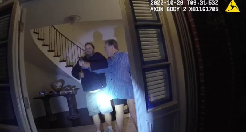 FILE - In this image taken from San Francisco Police Department body-camera video, the husband of former U.S. House Speaker Nancy Pelosi, Paul Pelosi, right, fights for control of a hammer with his assailant David DePape during a brutal attack in the couple
