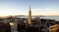 Three people rappel down the side of 853ft Transamerica Pyramid