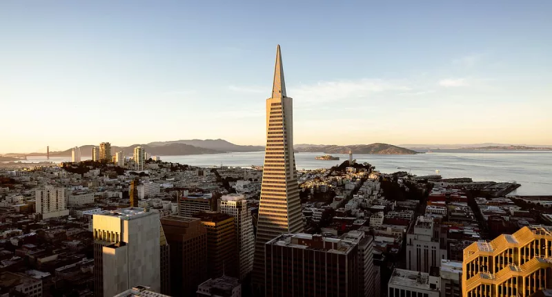 Three people rappel down the side of 853ft Transamerica Pyramid
