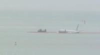 US Navy plane overshoots runway, ends up in Hawaii bay