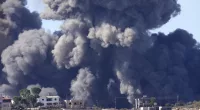Black smoke rises from an Israeli airstrike on the outskirts of Aita al-Shaab, a Lebanese border village