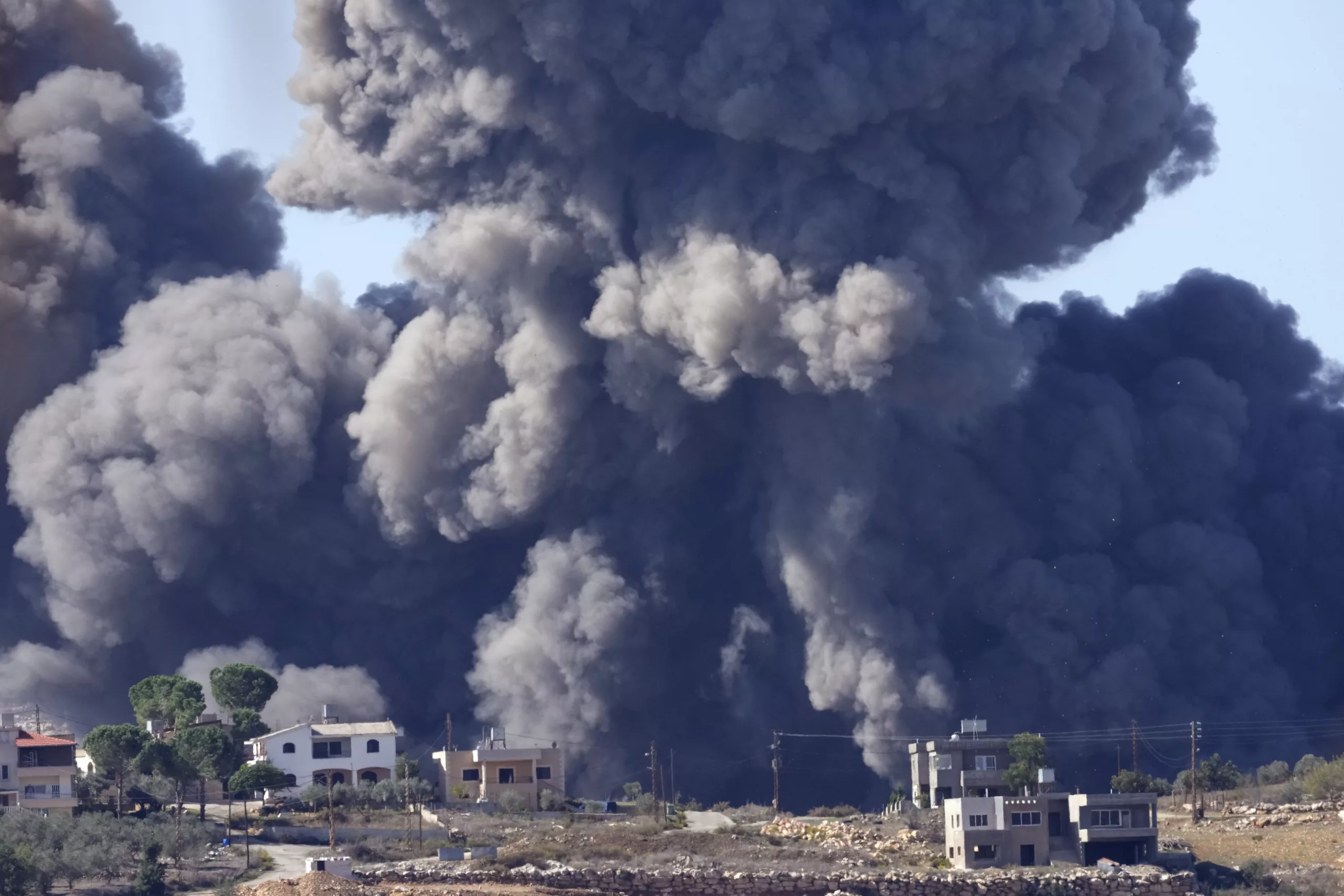 Black smoke rises from an Israeli airstrike on the outskirts of Aita al-Shaab, a Lebanese border village