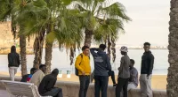 Migrants wait to learn their fate from Spanish government