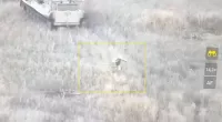 A soldier was seen diving out of the suicide tank and running for cover