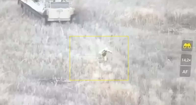 A soldier was seen diving out of the suicide tank and running for cover