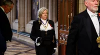 Black Rod, Sarah Clarke in her historic role, proceeding to the House of Commons