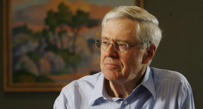 Charles Koch stands as the head of Koch Industries